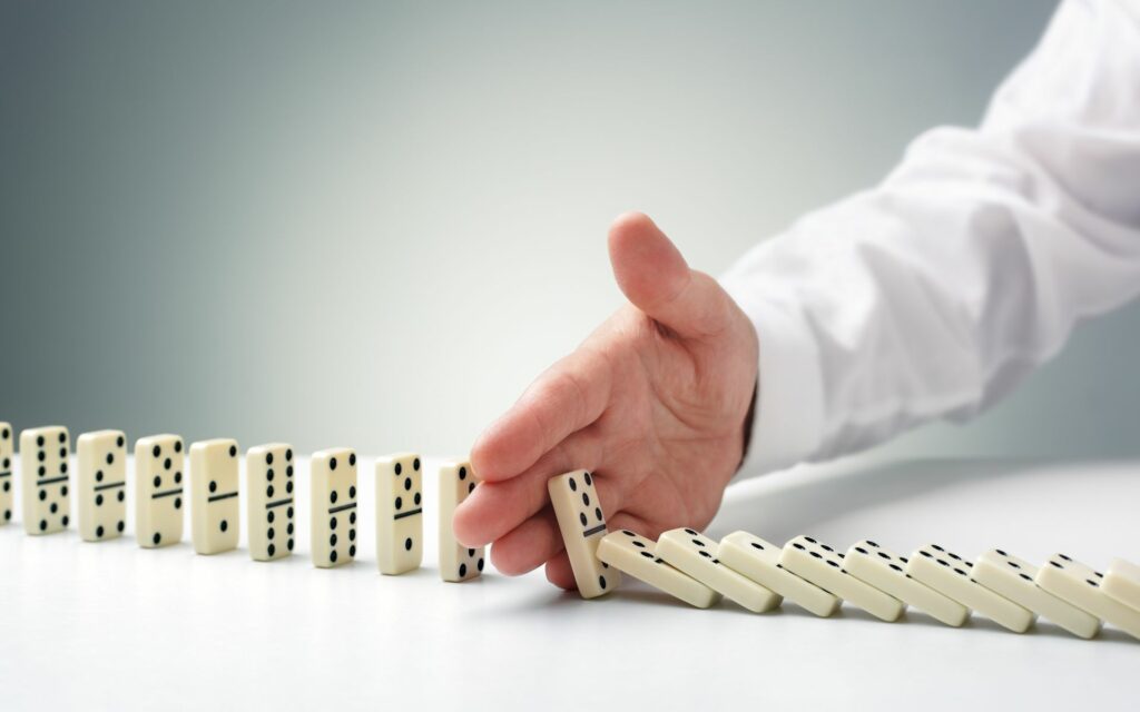 Stopping,The,Domino,Effect,Concept,For,Business,Solution,,Strategy,And