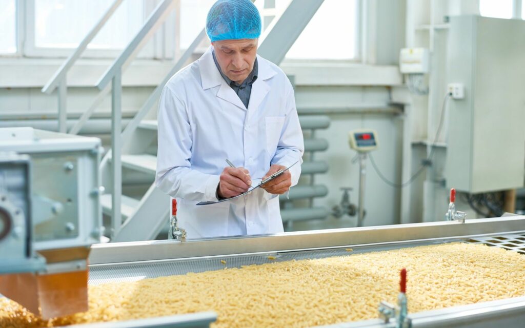 Senior Worker Overseeing Production of Food