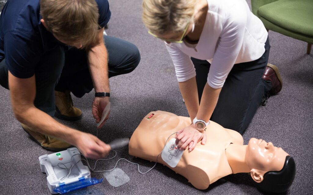Cpr,Training,Medical,Procedure,Workshop.,Demonstrating,Chest,Compressions,And,Use